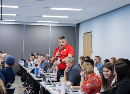 group of Alchemy clients receiving hands-on platform training by Alchemy product experts