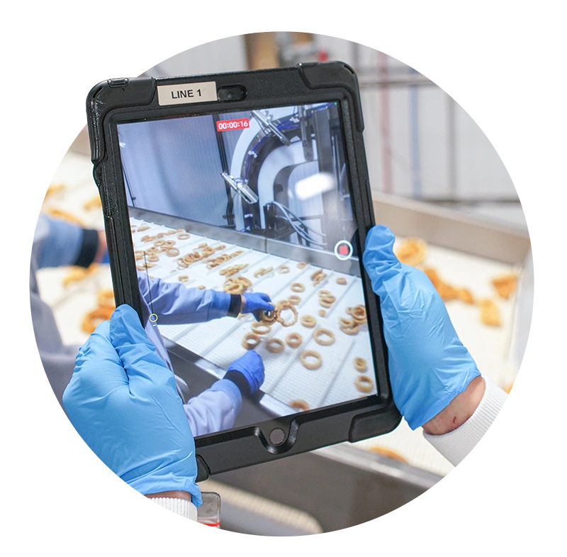 Video of conveyor belt in Ajinomoto facility being recorded on a tablet